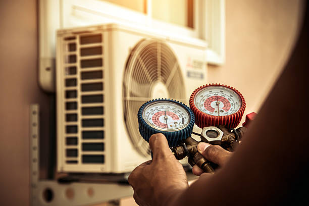 Professional Air Conditioning Service technician working in Grand Junction, CO